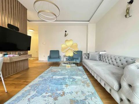 Spacious living room with sofa and TV. - image 3