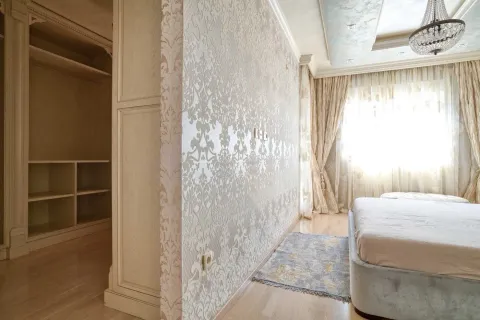 Spacious bedroom with a double bed and built-in wardrobe. - image 14