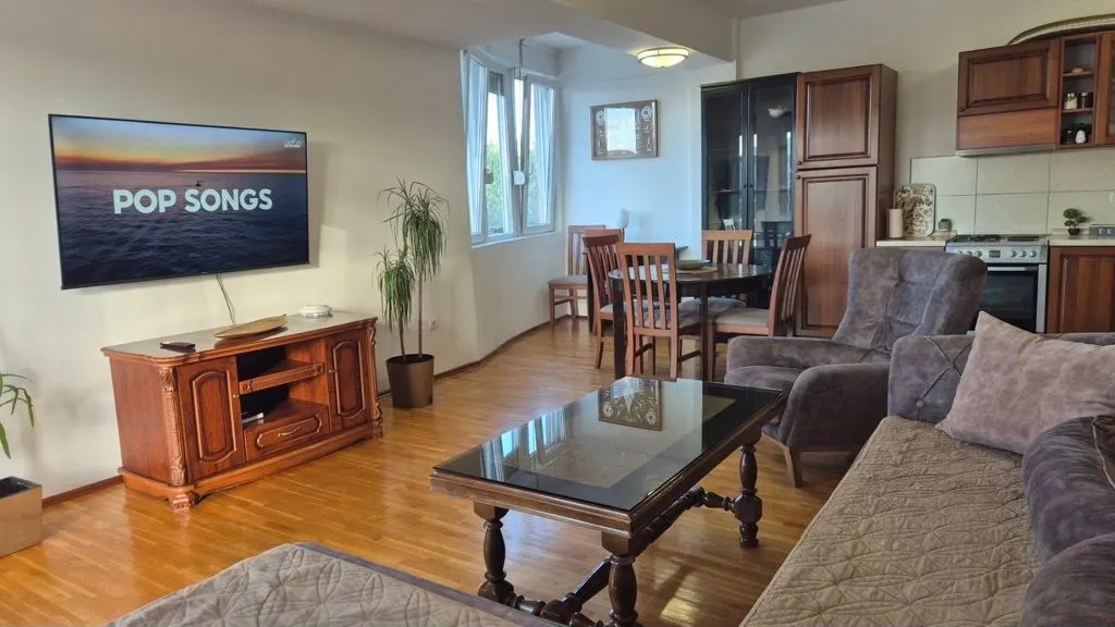 Living room connected with the dining area and kitchen.