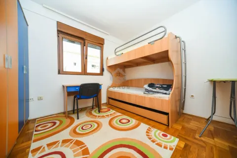 Children's bedroom with a bunk bed, desk, and wardrobe. - image 10