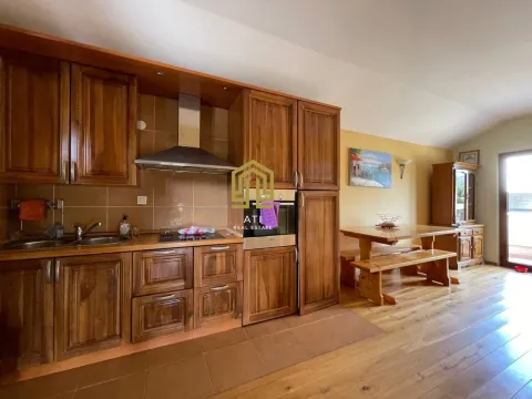 Spacious wooden kitchen connected to the dining area. - image 6