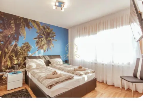 Bedroom with a double bed and a palm tree photo wallpaper. - image 3