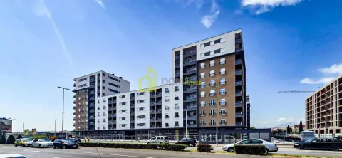 View of the exterior of a modern residential building with a street in the foreground. - image 3