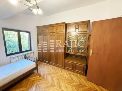Furnished bedroom with wooden wardrobe and bed. - image 6