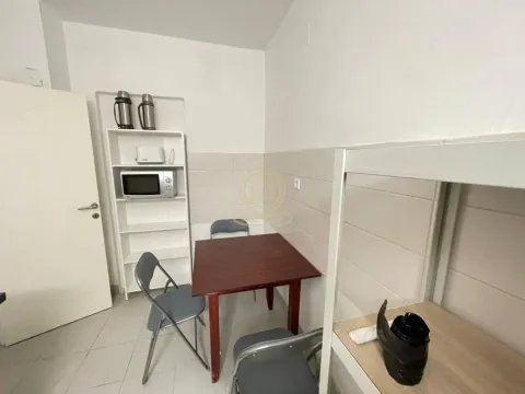 Small kitchen with a dining table and chairs. - image 7