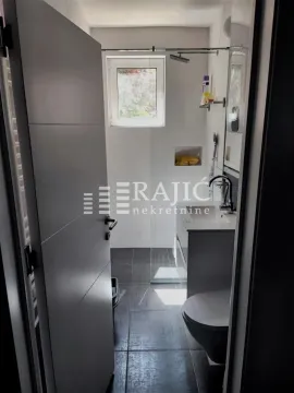 View of a modern bathroom with a walk-in shower. - image 13