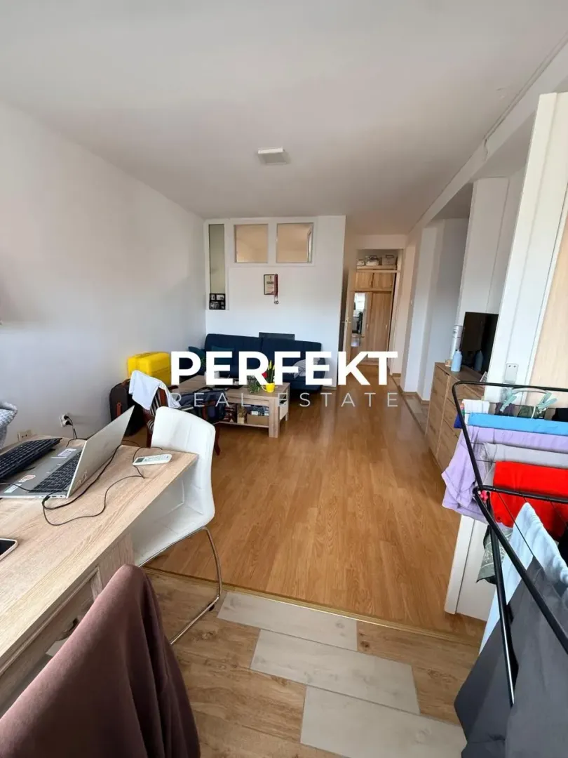 Living room with a desk and seating set.