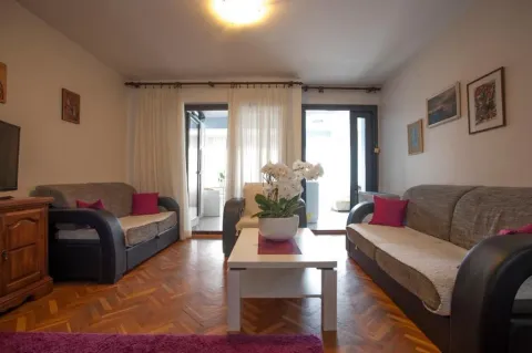 Living room with a seating set, coffee table, and access to the terrace. - image 3