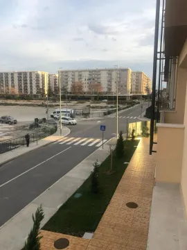 View from the terrace overlooking the street and surrounding residential buildings. - image 7