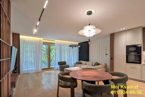 Living room with dining area and modern furniture. - image 2