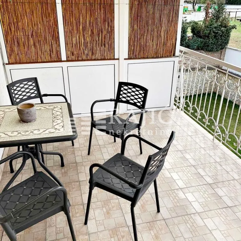 Furnished terrace with seating set.