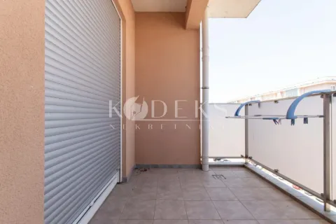 Covered balcony with ceramic tiles and window shutters. - image 10