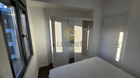 Bright bedroom with a white wardrobe and bed. - image 12