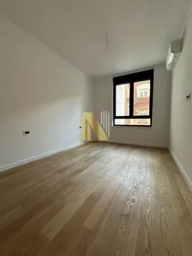 Empty room with parquet flooring and an air conditioner. - image 4