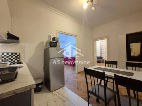 Kitchen with dining area and a view of the interior rooms. - image 5