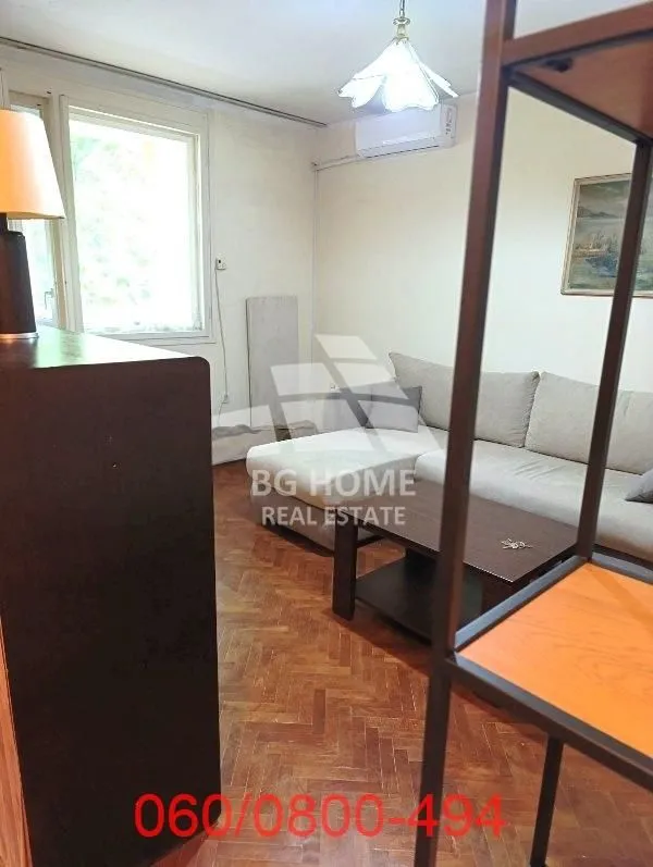 Living room with a sofa set and wooden flooring.