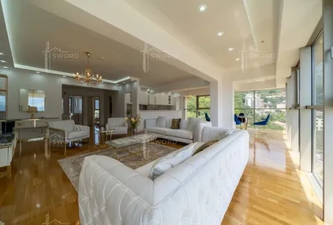 Spacious and bright living room with seating area and surrounding view. - image 2