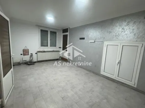 An empty room with grey walls and ceramic tile flooring. - image 3