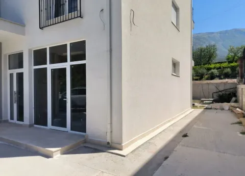 Exterior of a modern house with glass entrance doors and a courtyard. - image 4