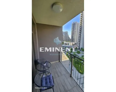 Covered balcony with seating set and a view of the neighborhood and city buildings. - image 14