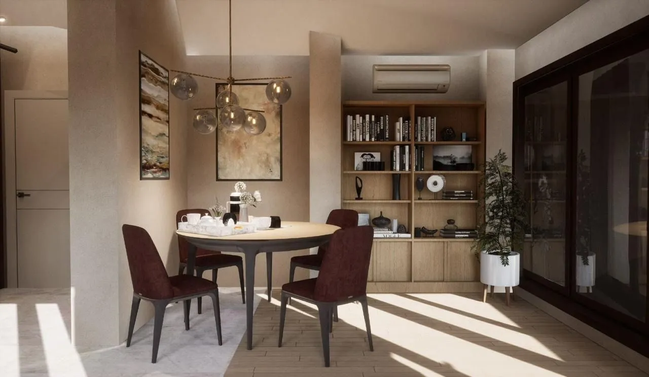 Dining area with a round table and chairs as part of the living room.