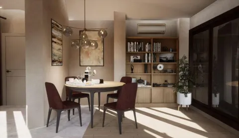 Dining area with a round table and chairs as part of the living room. - image 12