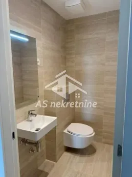Bathroom tiled in ceramics with a sink and toilet. - image 22