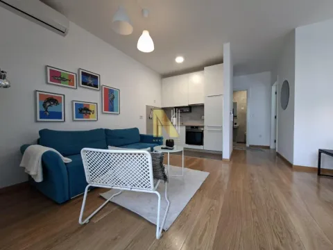 Living room with a sofa, armchair and open space towards the kitchen. - image 17