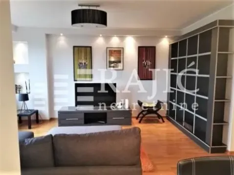 Living room with sofa, TV unit and a large bookshelf. - image 15