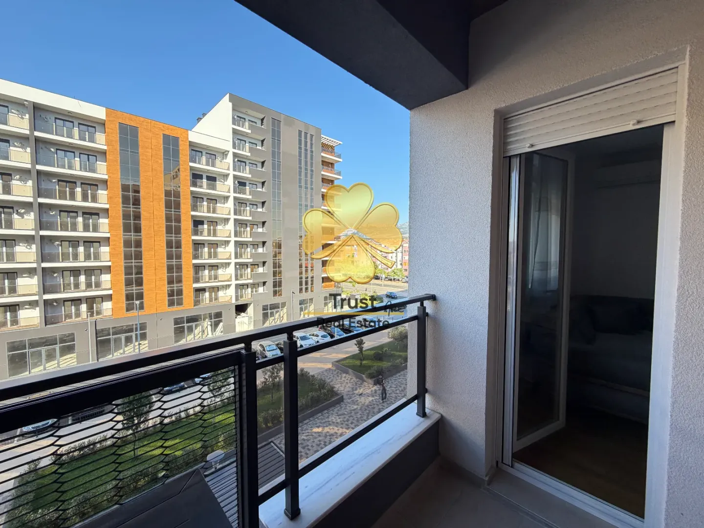 View from the terrace overlooking neighboring buildings and the surrounding area.
