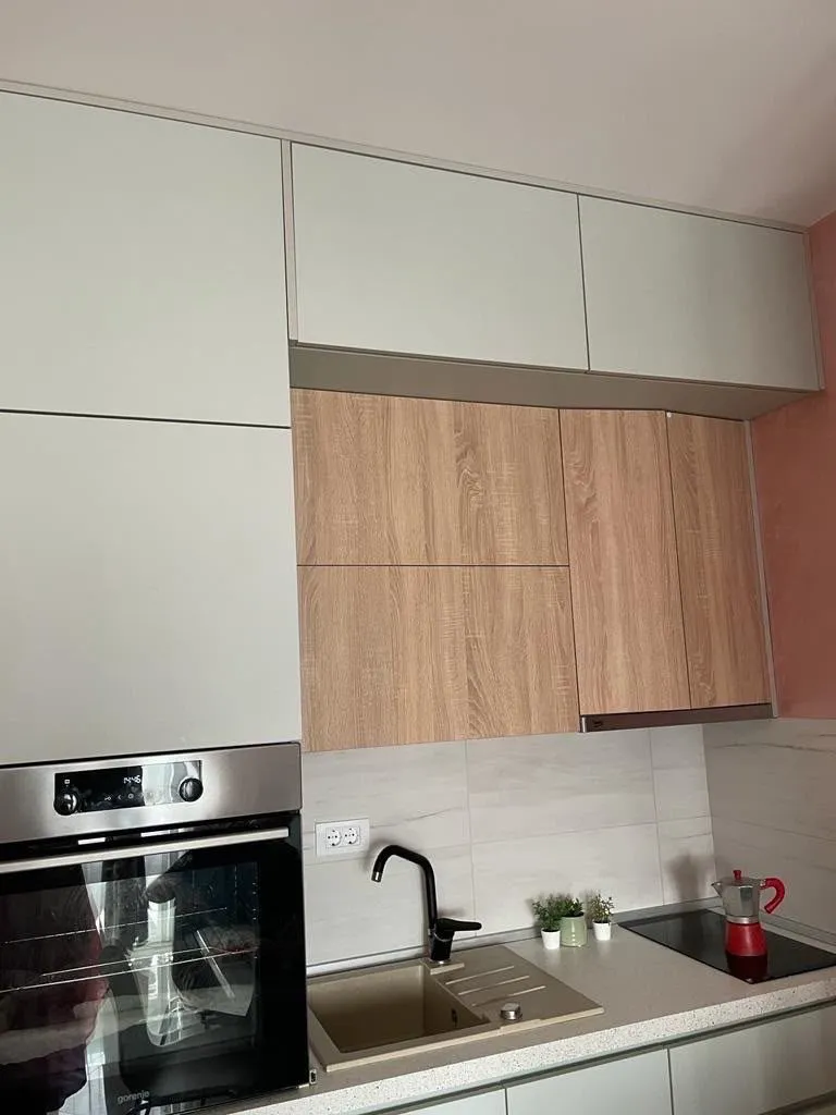 Modern kitchen with built-in cabinetry and appliances.