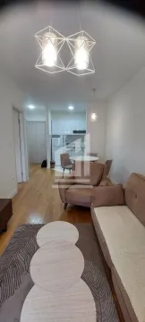 Living room with dining area and kitchen in the background. - image 2