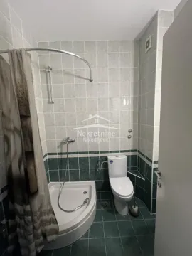 Bathroom equipped with a shower cabin and sanitary ware. - image 16