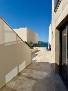 Paved terrace of a modern building with a sea view. - image 10