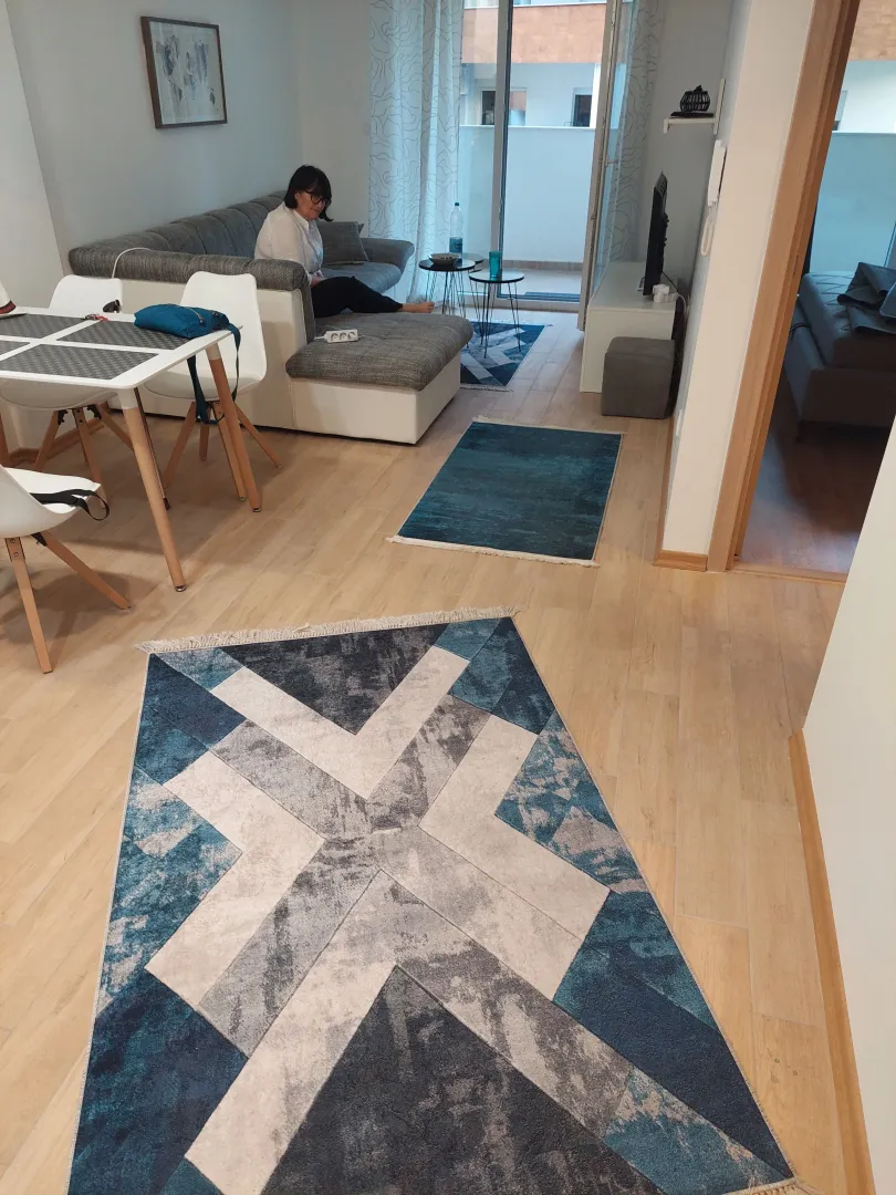 Living room with sofa set and dining area.