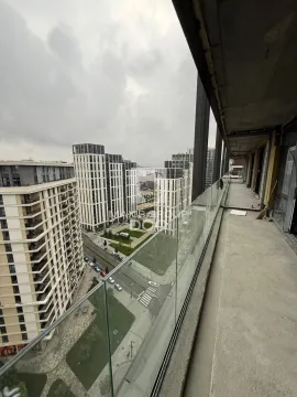 View from the balcony under construction towards surrounding buildings and neighborhood. - image 11