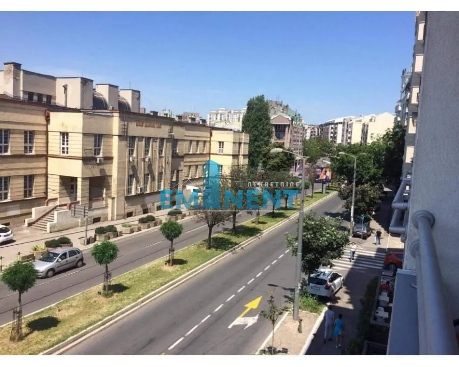 View from the terrace of the city street and surrounding buildings.