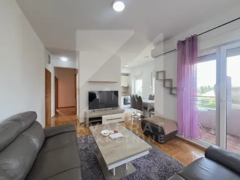 Living room connected to the dining area and kitchen, with access to the terrace. - image 2