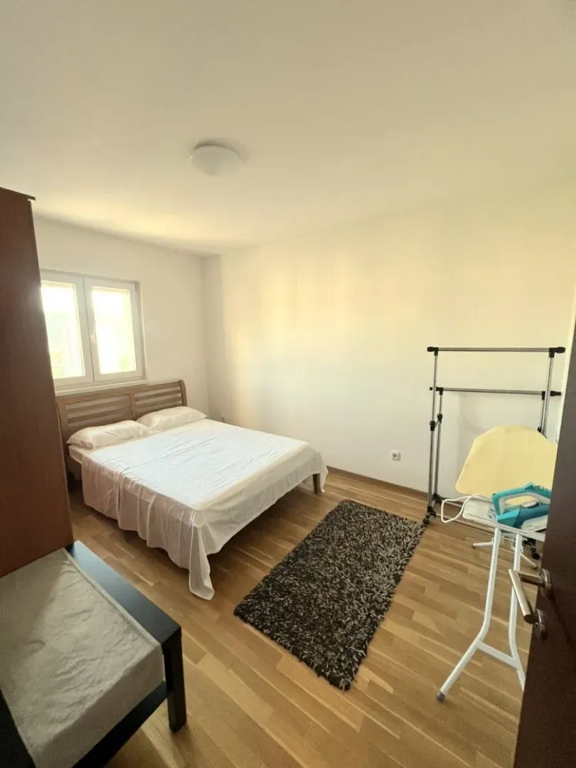 Furnished bedroom with a double bed.