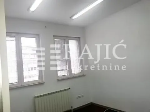 Empty room with white walls and two windows. - image 3