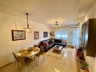 Spacious living room with dining area and sofa set.