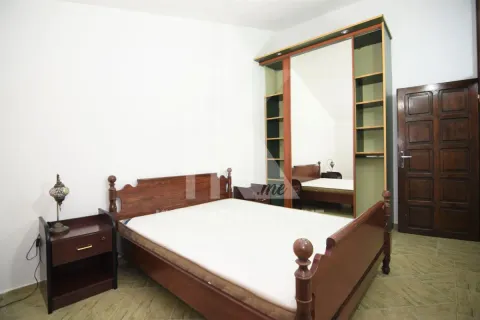 Bedroom with a double bed, nightstand, and a large wardrobe with a mirror. - image 7