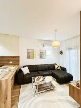 Living room with a sofa and coffee table. - image 9