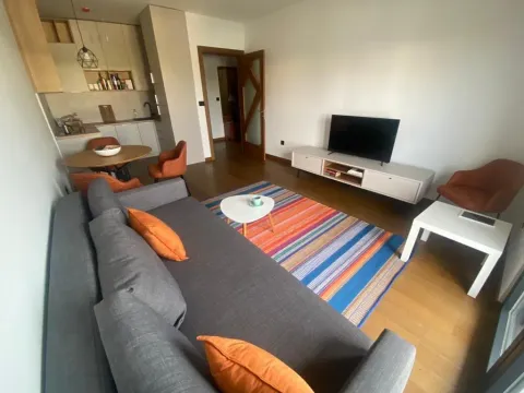 Spacious living room connected to the dining area and kitchen. - image 3
