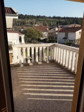 View from a terrace with a concrete railing overlooking the neighborhood. - image 30