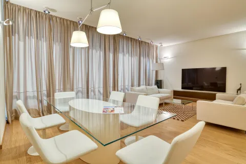 Spacious and bright living room with a dining area and modern furniture. - image 16