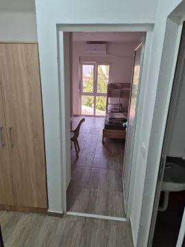View from the hallway into a bedroom with a bunk bed. - image 6
