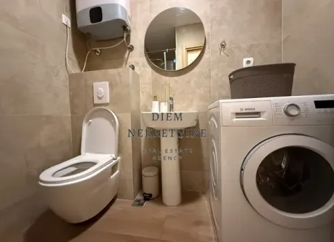 Modernly equipped bathroom with sanitary fixtures and a washing machine. - image 11