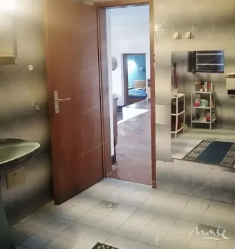 View from the bathroom towards the hallway and bedroom. - image 15