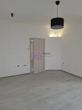 Empty room with white walls, laminate flooring, and a pendant lamp. - image 6